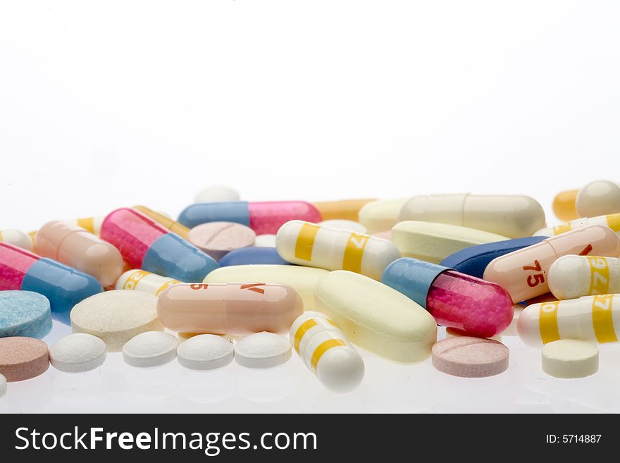 Pills and capsules on white background. Pills and capsules on white background