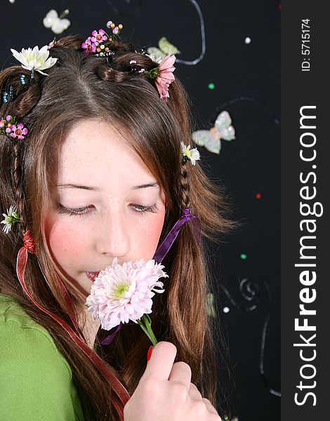 Teenage model with flowers and butterflies in her hair. Teenage model with flowers and butterflies in her hair