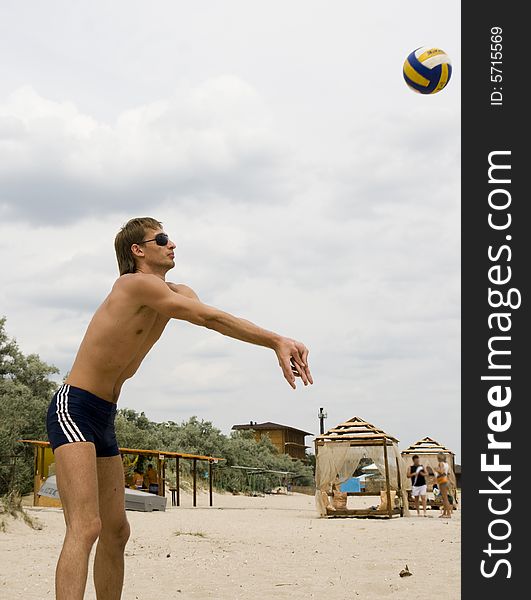 Man playing sport game on beach