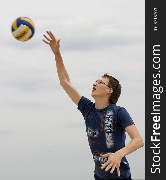 Man playing volleyball on sky background. Man playing volleyball on sky background
