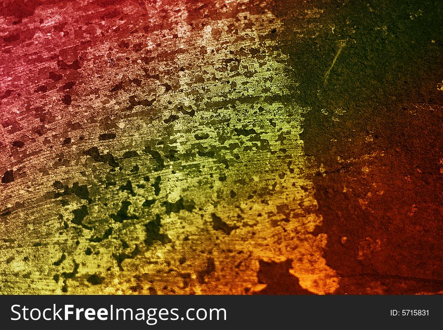 A rainbow colored rusted metal  grunge textured background. A rainbow colored rusted metal  grunge textured background