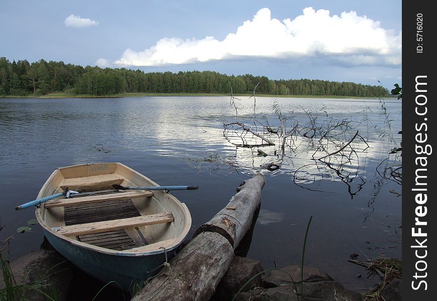 Old boat at lake coast