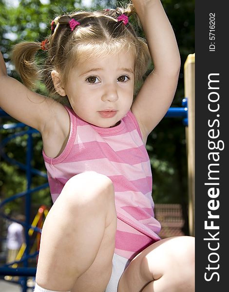 Little girl playing on playground