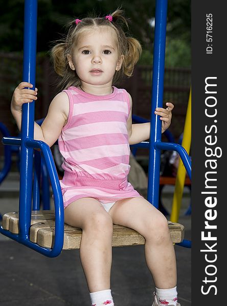 Little girl playing on playground