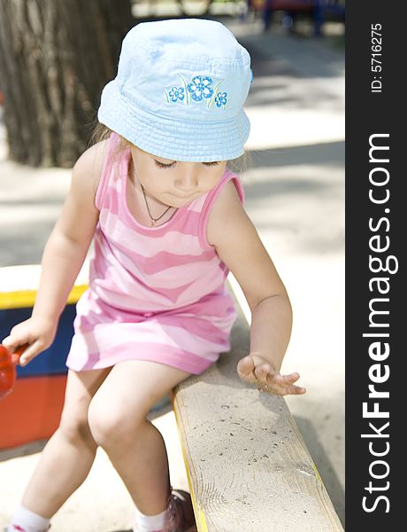 Little cute girl in sandbox