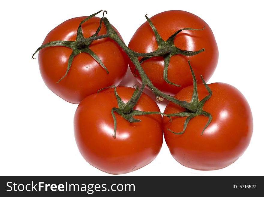 Group of four red tomato isolated on white