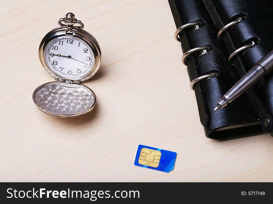 Pocket watch with notebook and SIM card. Pocket watch with notebook and SIM card