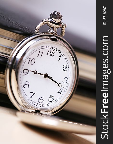 Pocket watch with balck notebook. Pocket watch with balck notebook
