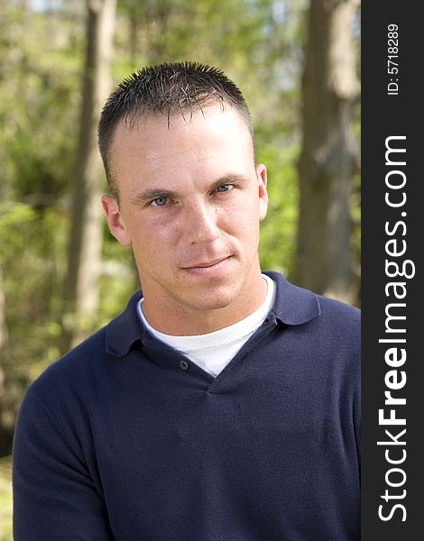 Young man outdoor portrait, waist up shot. Young man outdoor portrait, waist up shot