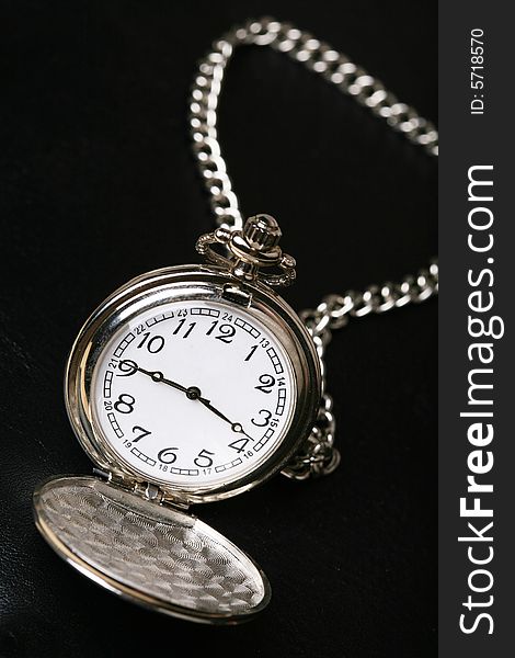 Pocket watch with black background