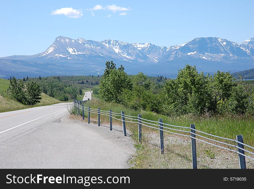 Highway and mountains in waterton lake national park, canada