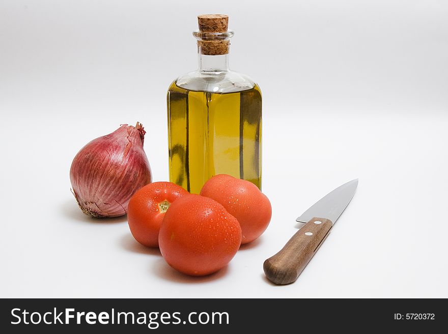 Onion, tomatoes, a bottle of oil - all for salad