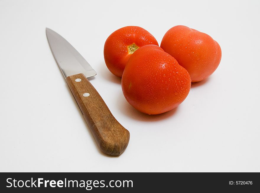 Knife and tomatoes - parts for salad