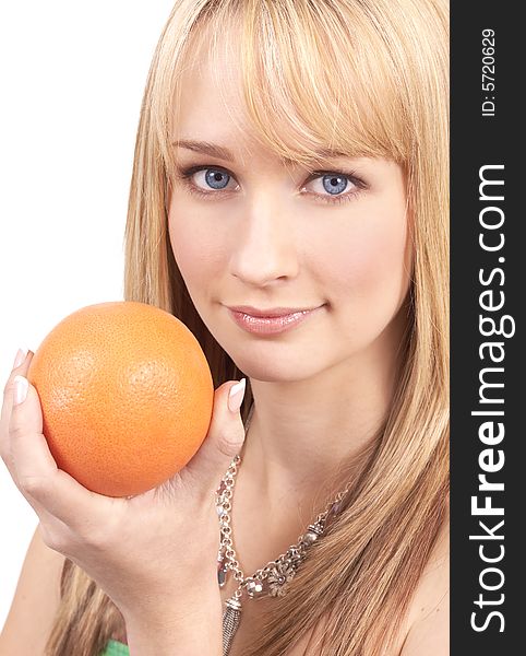 Portrait of a beautiful blonde woman with light blue eyes, holding a yellow grapefruit. Portrait of a beautiful blonde woman with light blue eyes, holding a yellow grapefruit