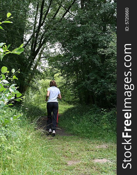 Female jogger in forest