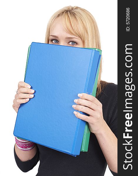 Beautiful blonde businesswoman hiding behind the blue file. Isolated on white background