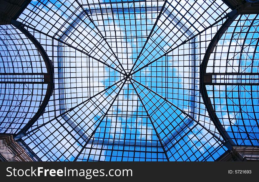 Trellised glazed dome, sky background