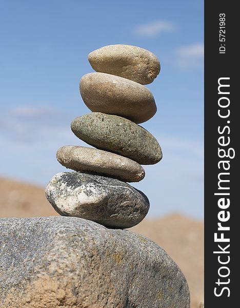 Pyramid of stones , Pebble combined in a pyramid on a background of the sky