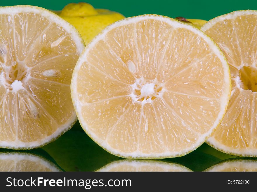 Slices of lime in green background. Slices of lime in green background