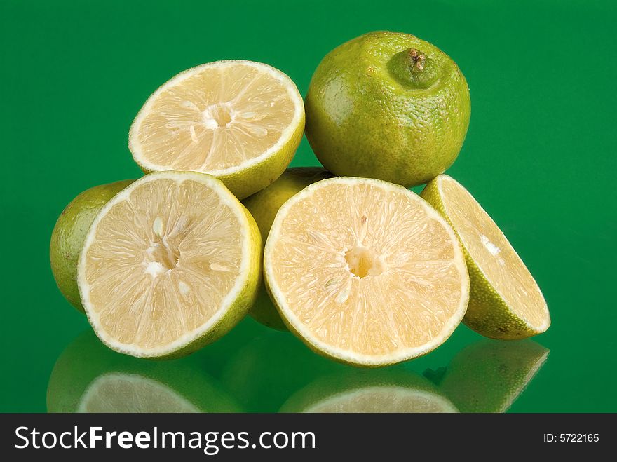 Fresh limes in green background