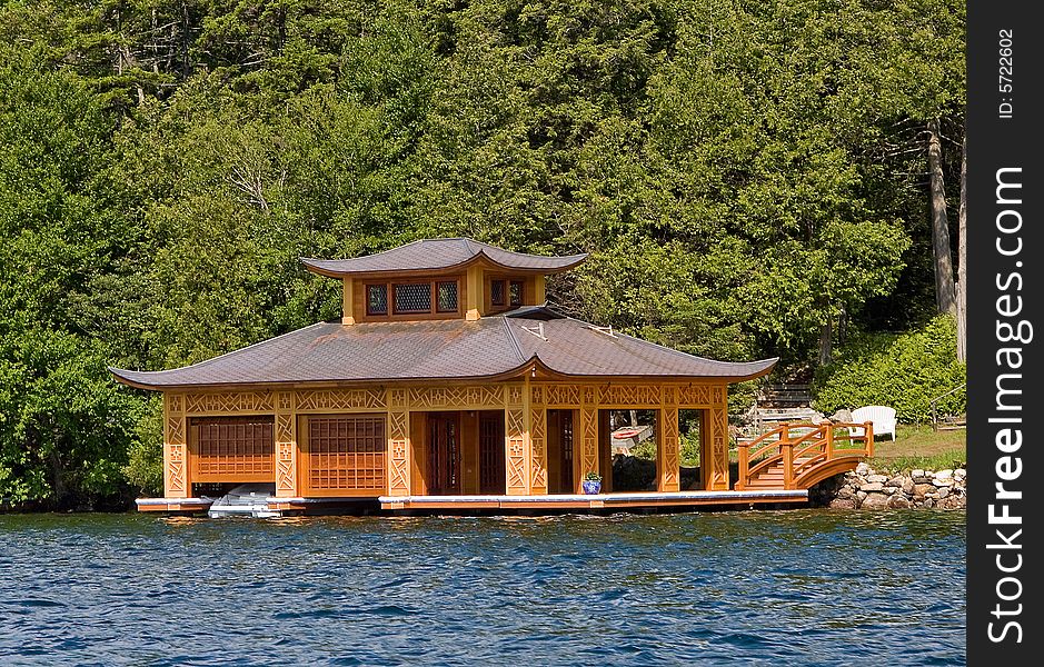 Oriental building on the water like a pagoda with boats inside. Oriental building on the water like a pagoda with boats inside