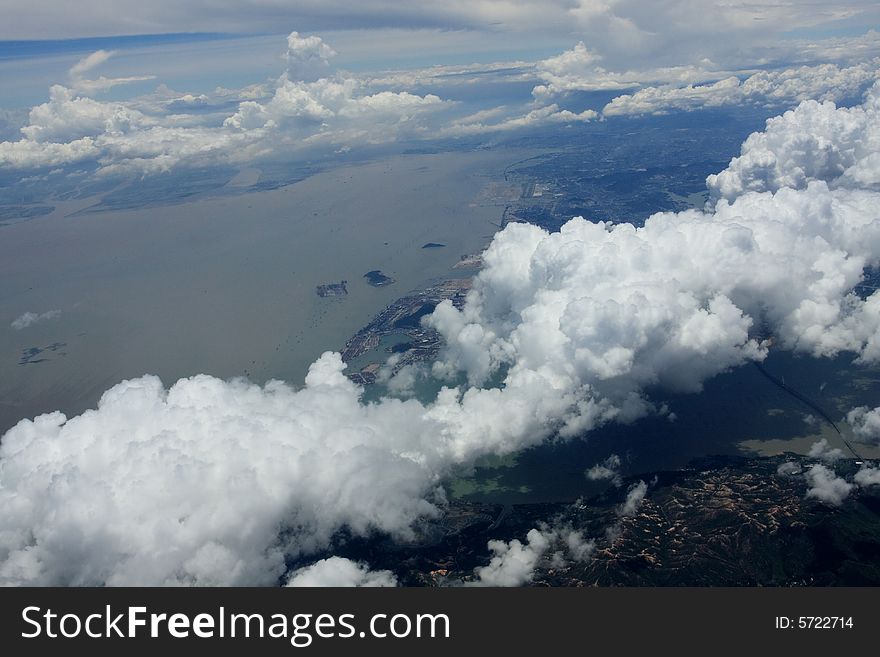 Clouds over island and ocean. Clouds over island and ocean