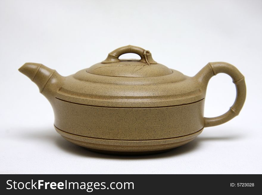 An teapot on white background.