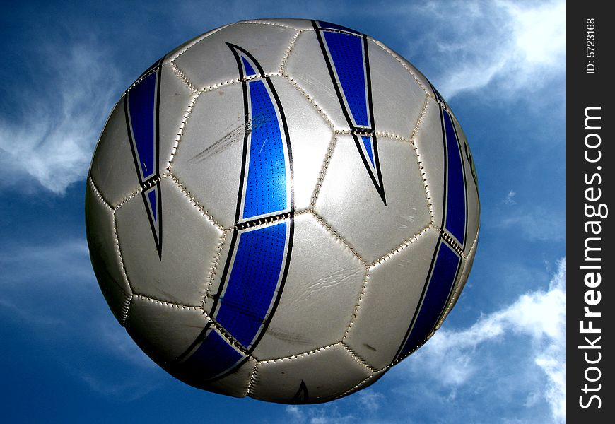 Soccer ball on sky background