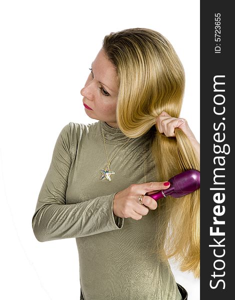 Long hair blonde woman with hairbrush in her hand