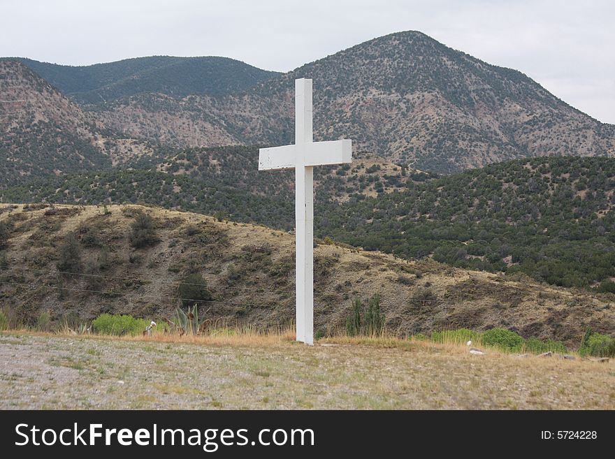 Isolated cross stands still in the desert. Isolated cross stands still in the desert