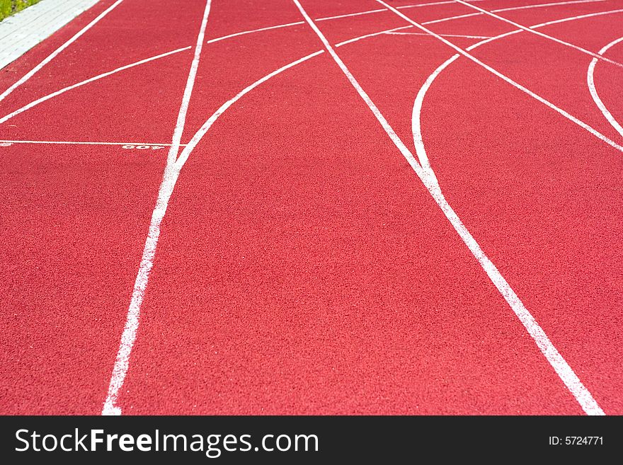 Red tartan athletic track on the stadium