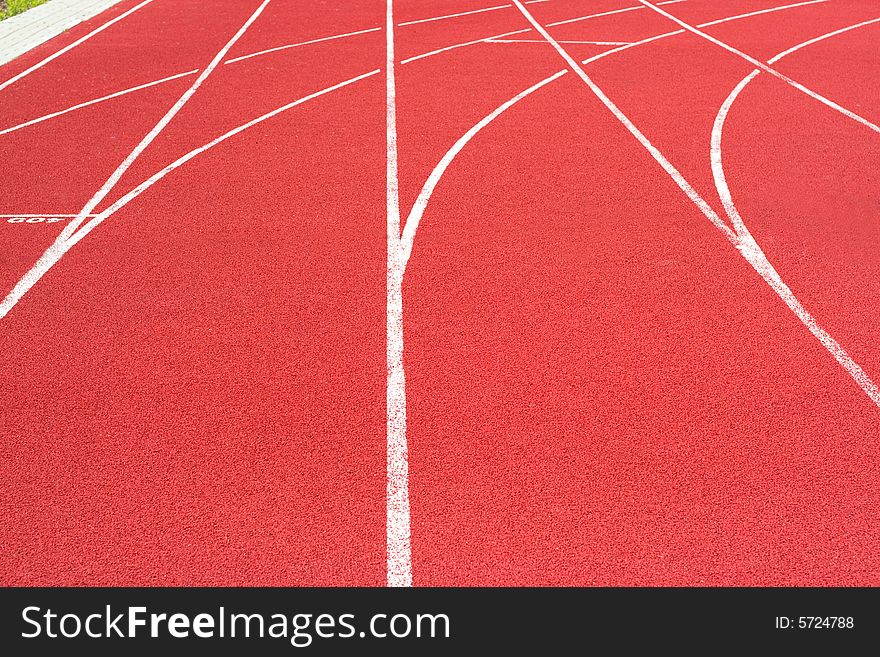 Red tartan athletic track on the stadium