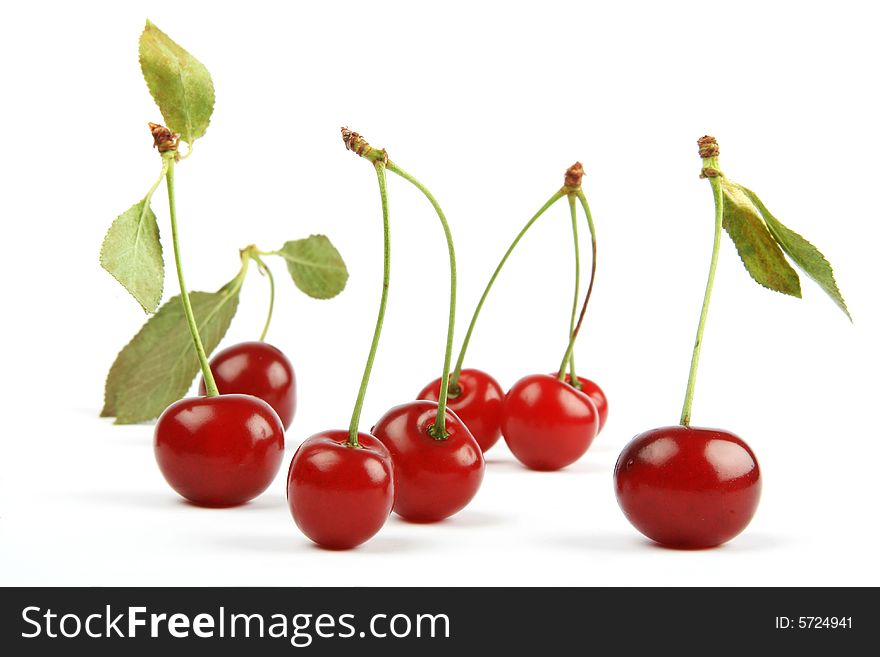 Sweet cherries berry with  green leaves