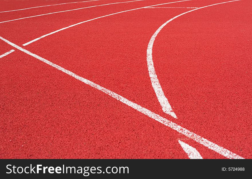 Red tartan athletic track on the stadium