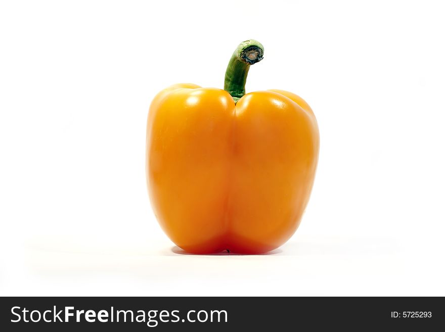 Alone orange bell pepper isolated on a white background.