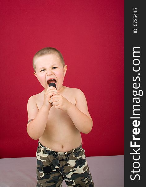 Boy sings, boy in military trousers, party