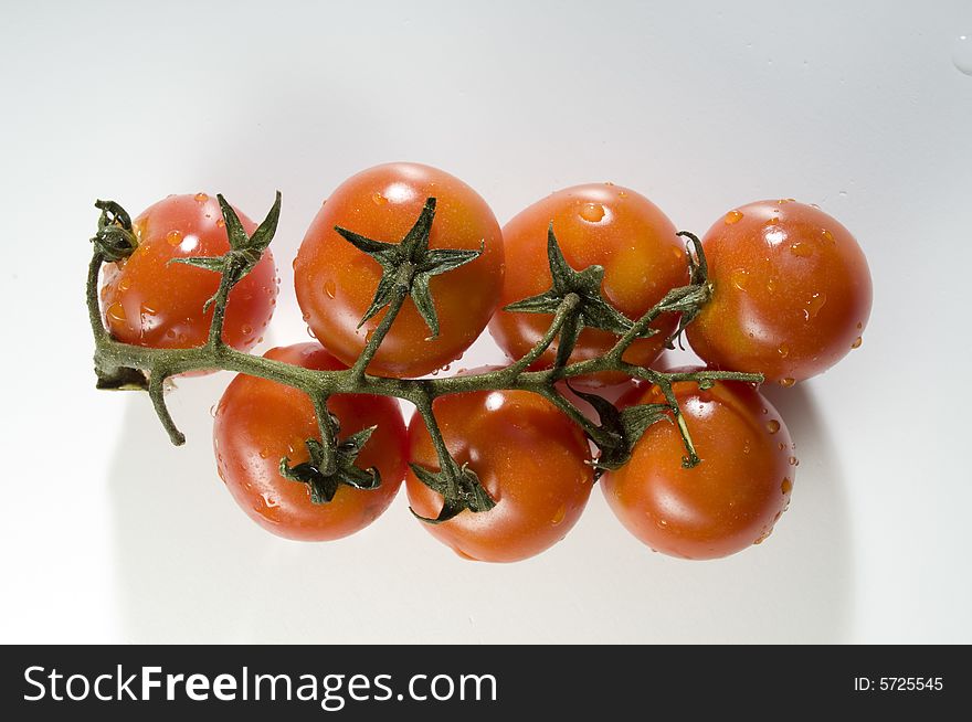 Red tomatoes with water drops