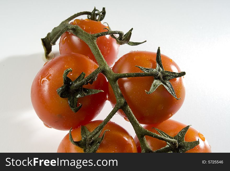 Red tomatoes with water drops