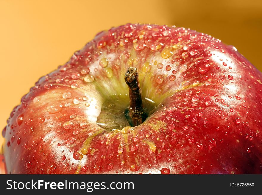 Macro shot of a red apple with drops of water. Macro shot of a red apple with drops of water.