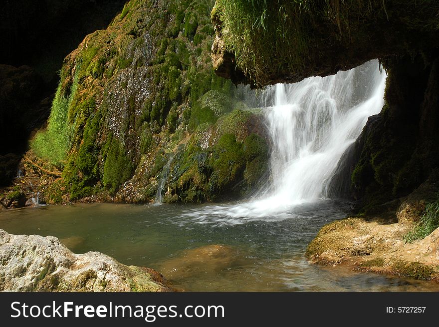 Green misty mountain waterfall in summer. Green misty mountain waterfall in summer