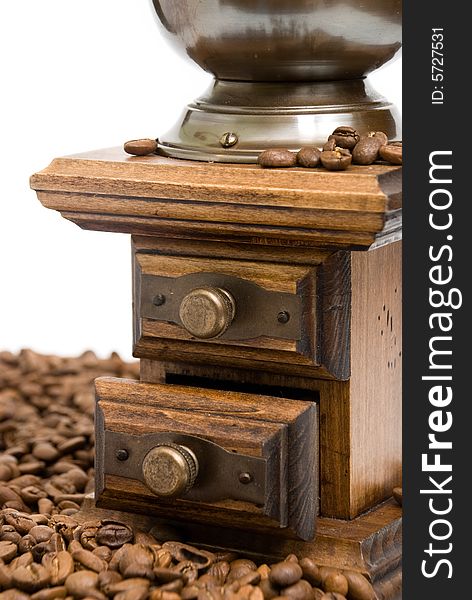 Old fashioned coffee grinder on the white background.