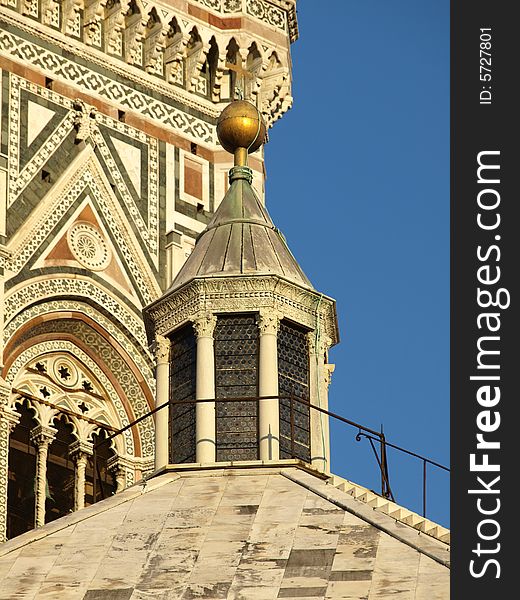 A wonderful shot of the top of the Florence Batipstery with the bell tower background. A wonderful shot of the top of the Florence Batipstery with the bell tower background