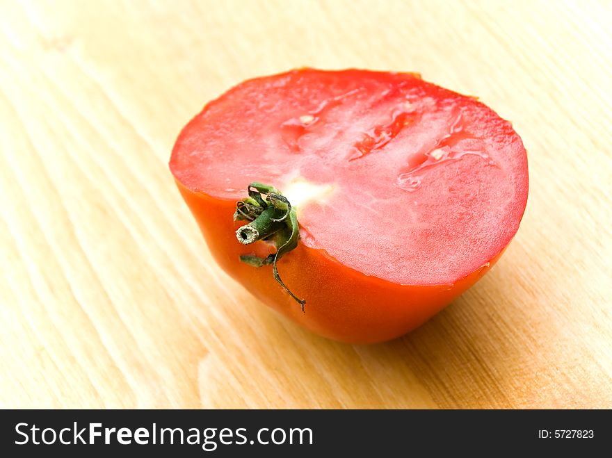 A half of ripe,fresh,red  tomato.