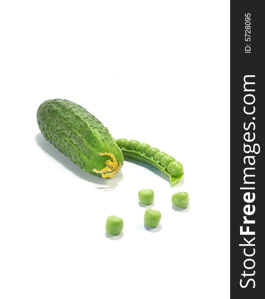 Ripe pea and cucumber isolated on a white background