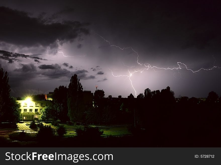 Lightning during night thunderstorm. on city