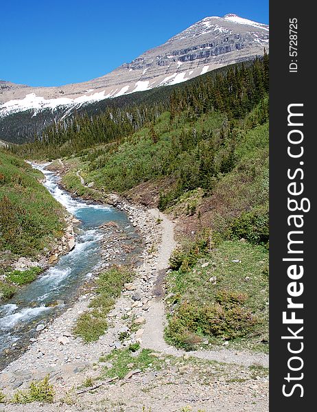 Snow mountain and river in glacier national park, usa. Snow mountain and river in glacier national park, usa