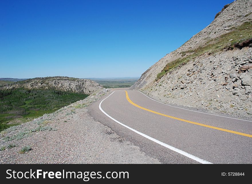 Sandy cliff and winding parkway in glacier national park, Montana, united states. Sandy cliff and winding parkway in glacier national park, Montana, united states