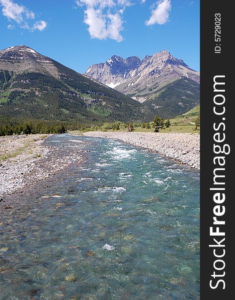 Riverbank And Mountains