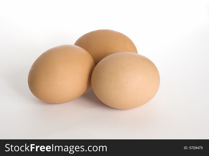 Three eggs on a white background