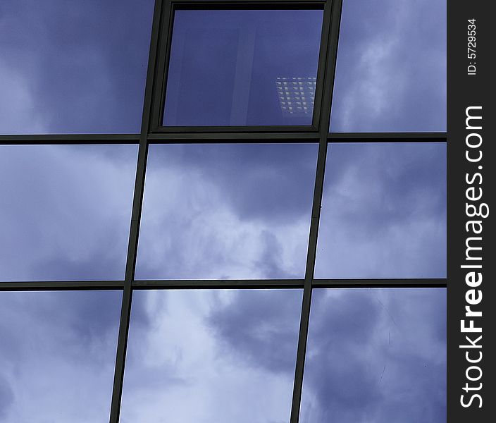 Cloud`s reflection in the office window. Cloud`s reflection in the office window